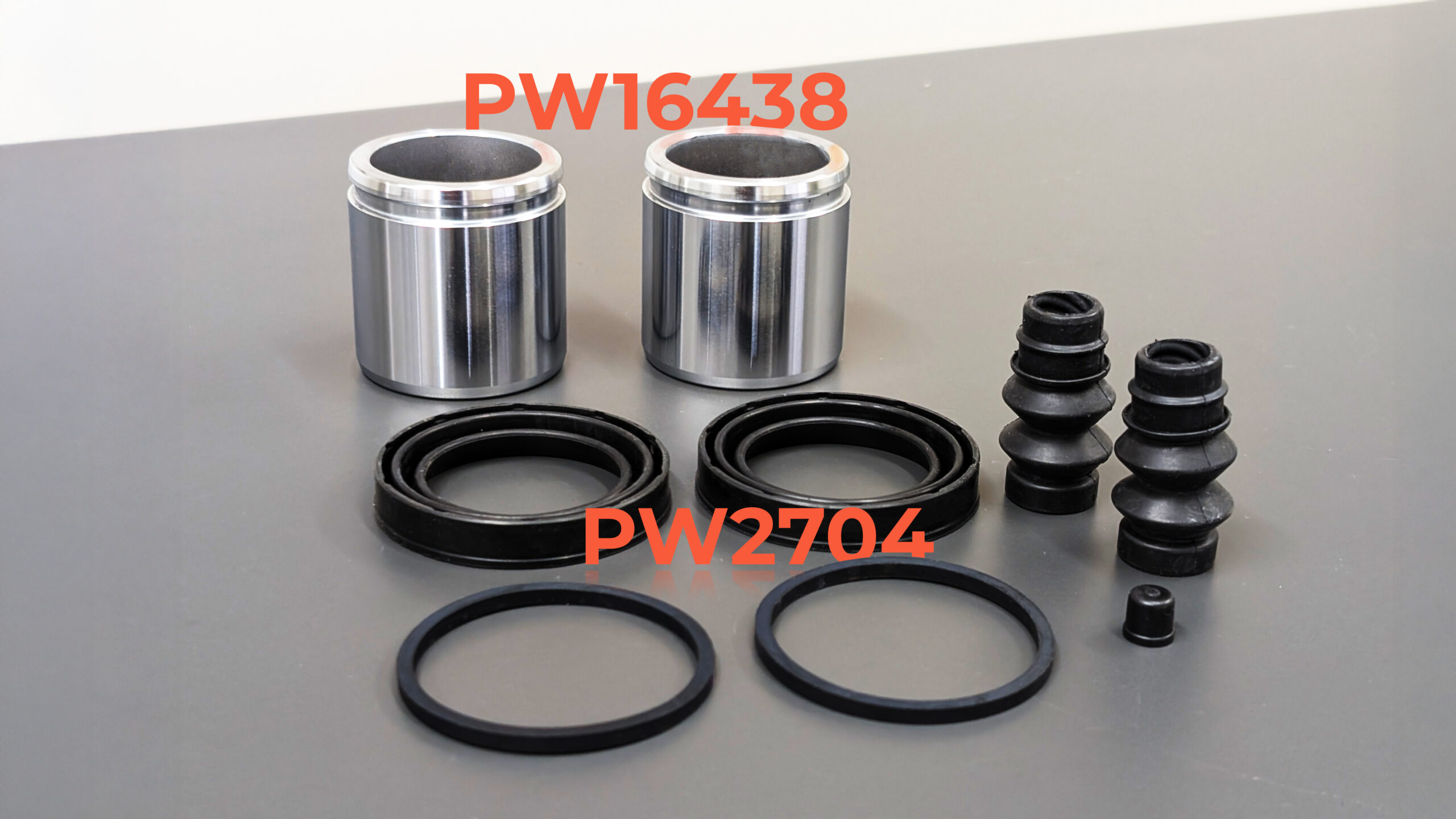 Photo of steel caliper pistons and caliper kit
